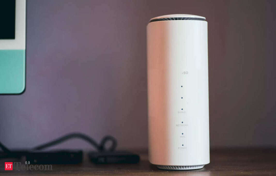 White wireless router on desk.