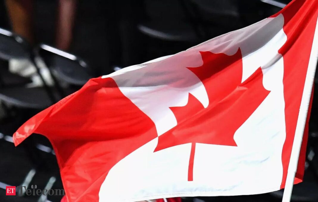 Waving Canadian flag, red and white with maple leaf.