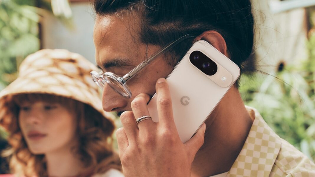 Man talking on smartphone, woman in background.