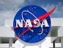 NASA logo on blue sign with clouds.