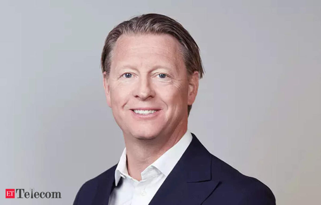 Smiling businessman in suit with white collar shirt