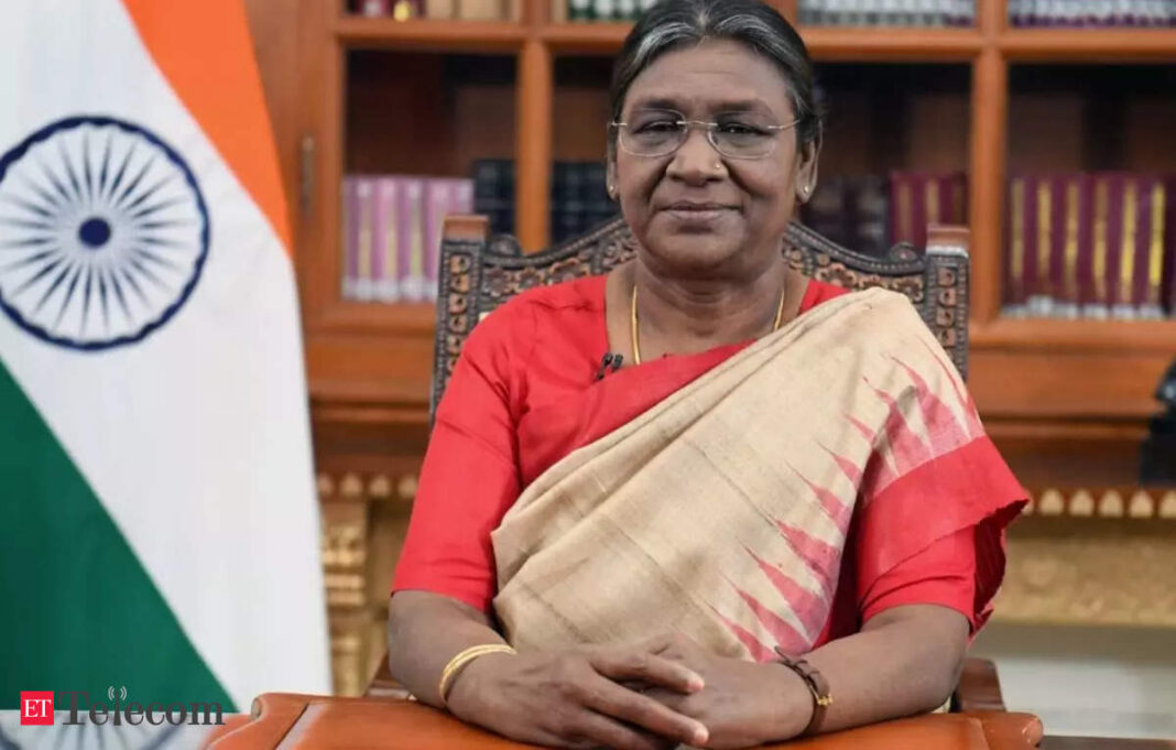 Woman in traditional attire with Indian flag background