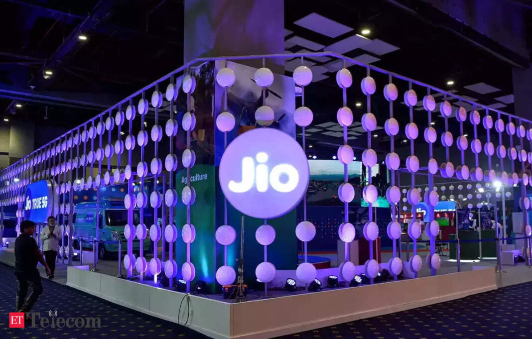 Jio exhibition booth with illuminated spherical lights.