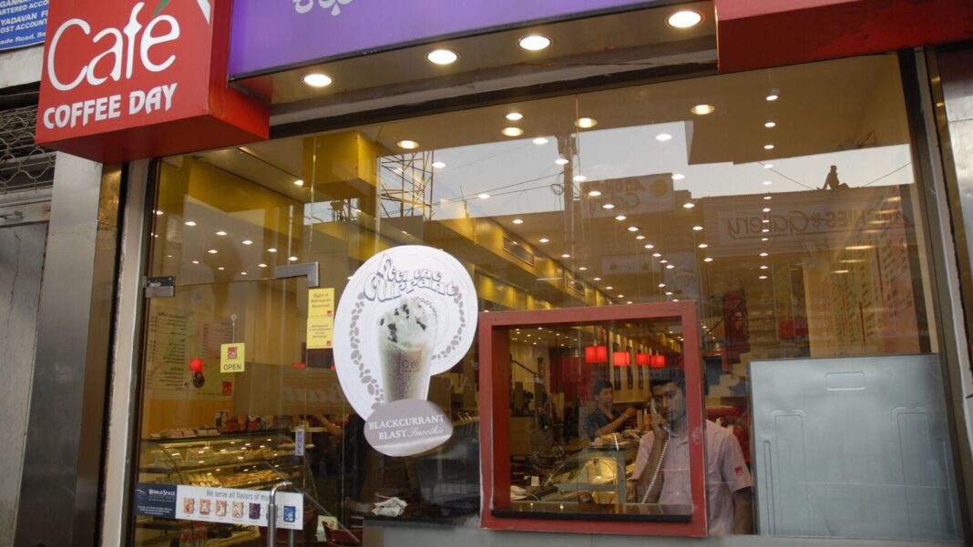 Café Coffee Day storefront with ice cream advertisement.