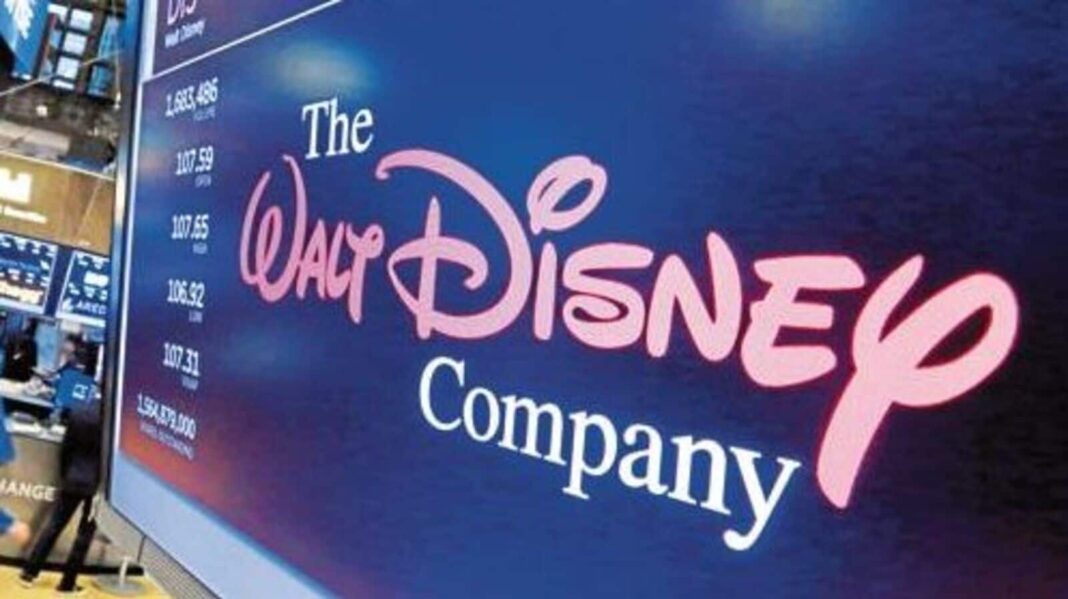 Disney stock prices displayed on electronic board.