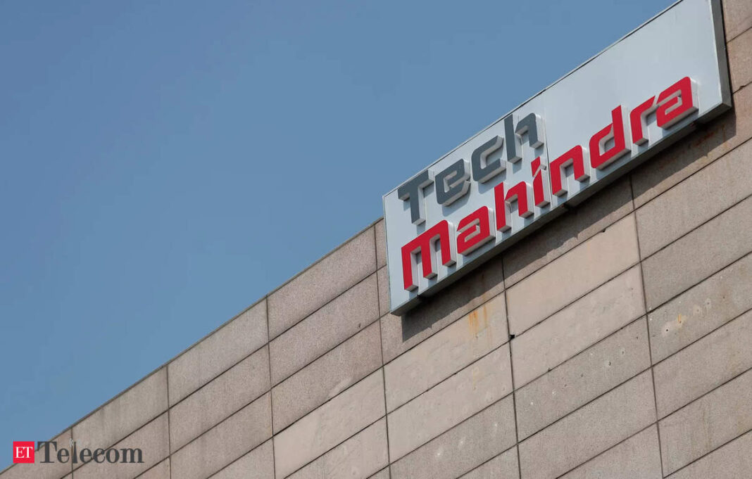 Tech Mahindra company sign on building facade.