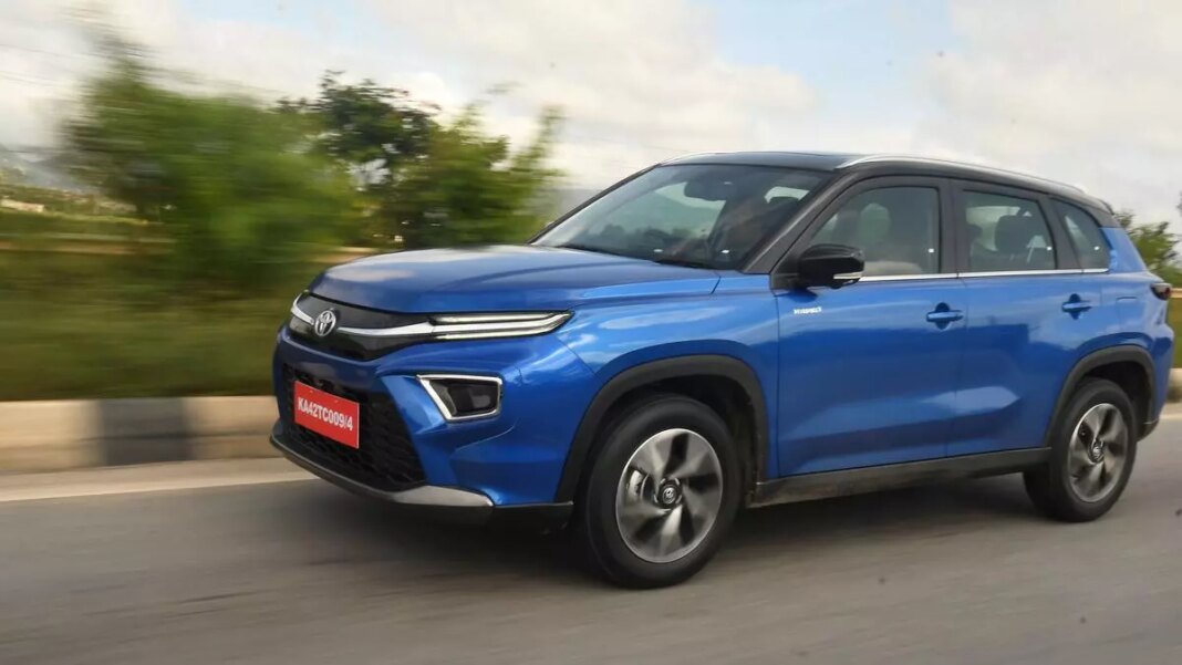 Blue compact SUV driving on road