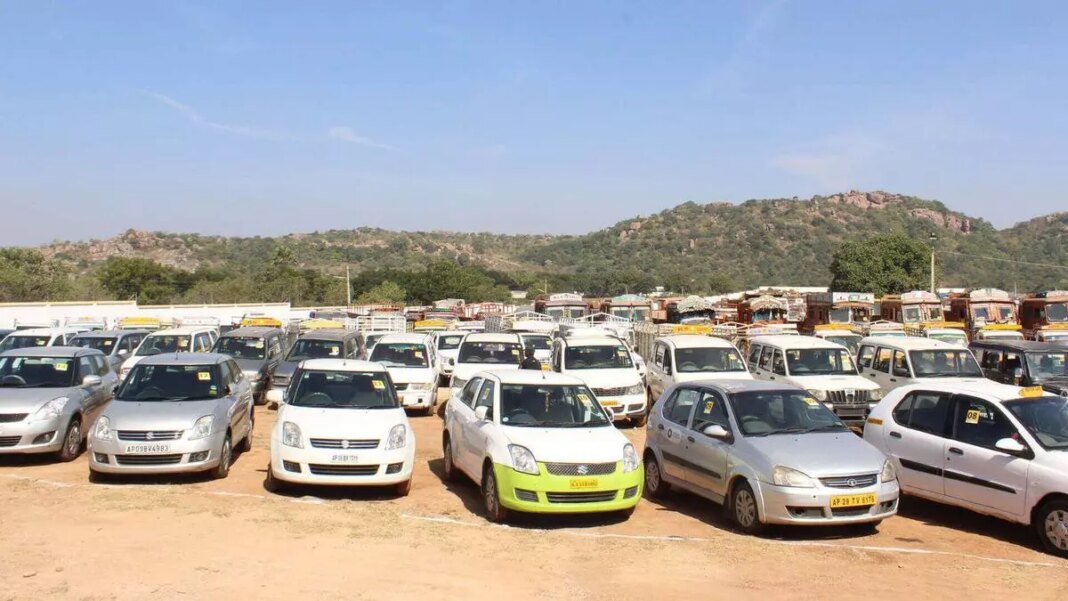 Overcrowded parking lot with various cars and buses.