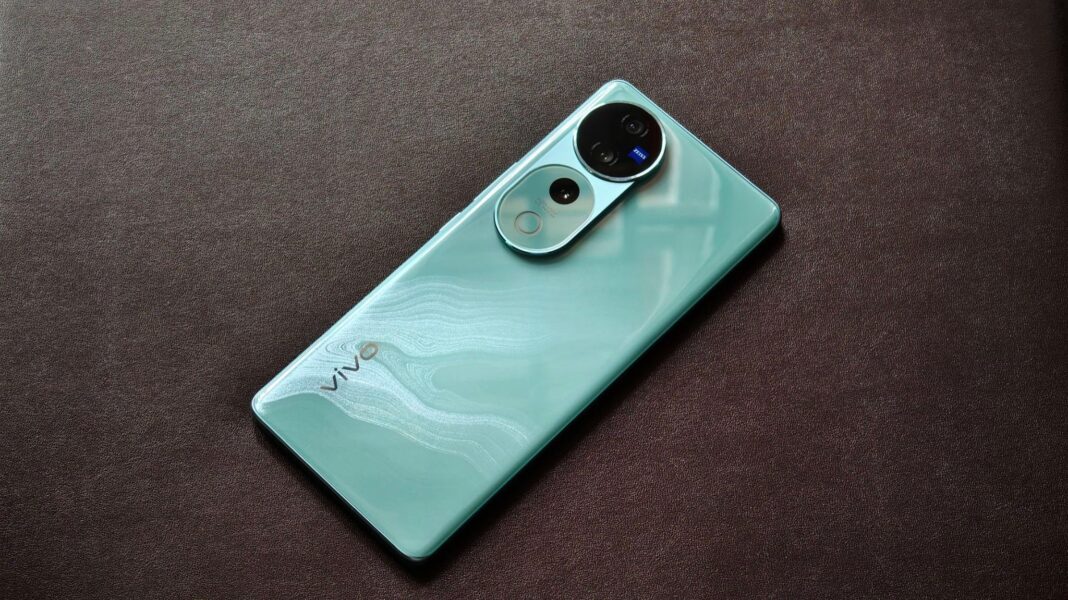 Mint green smartphone with dual cameras on textured surface.