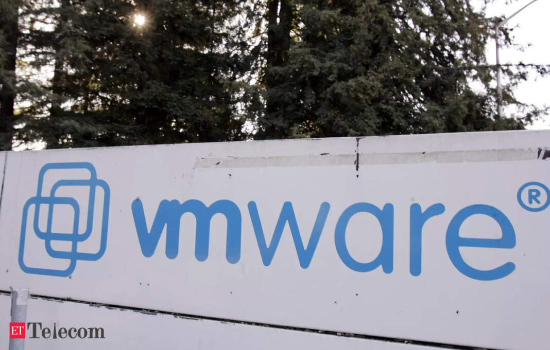 VMware logo on outdoor signboard with trees.