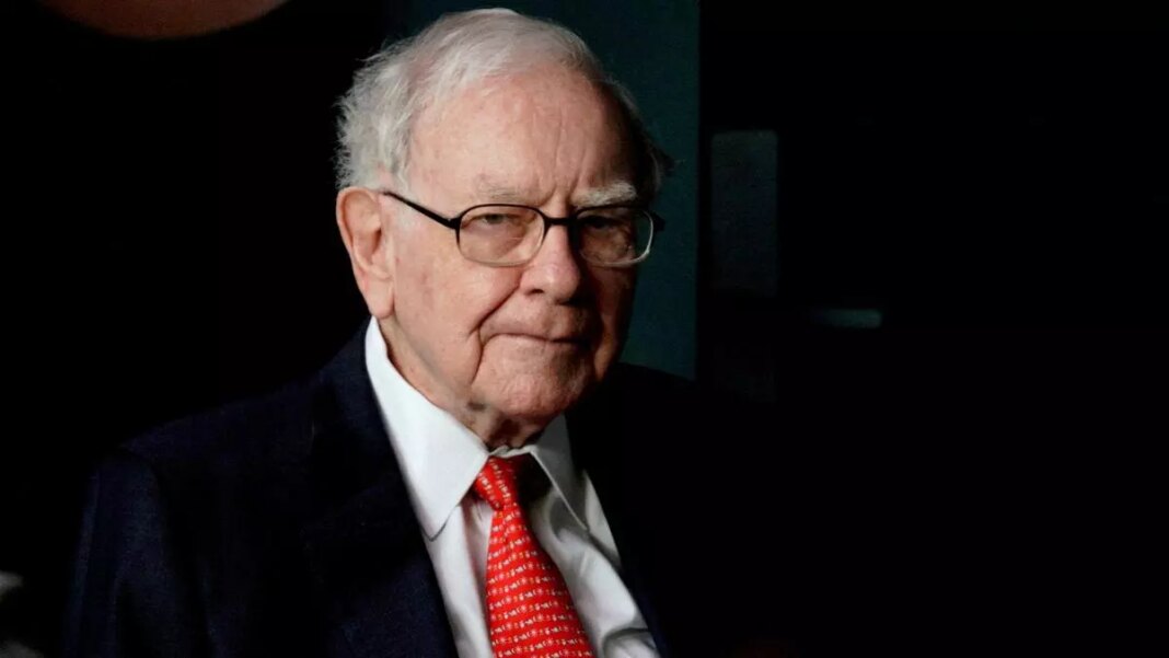 Elderly businessman in suit with a red tie.