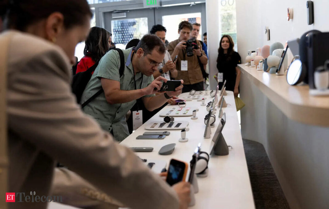 Customers exploring new technology products in store.