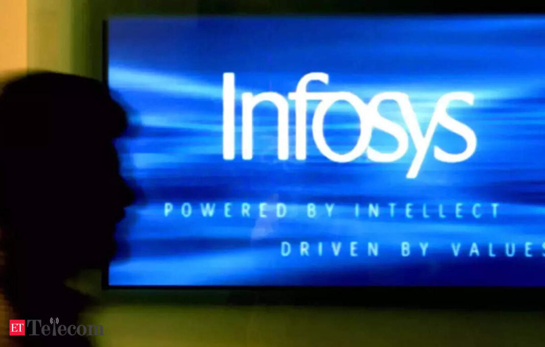 Silhouette near glowing Infosys logo screen.