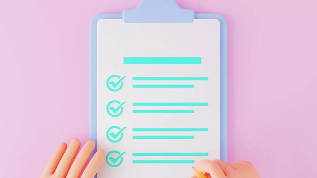 Clipboard with checklist on pink background.