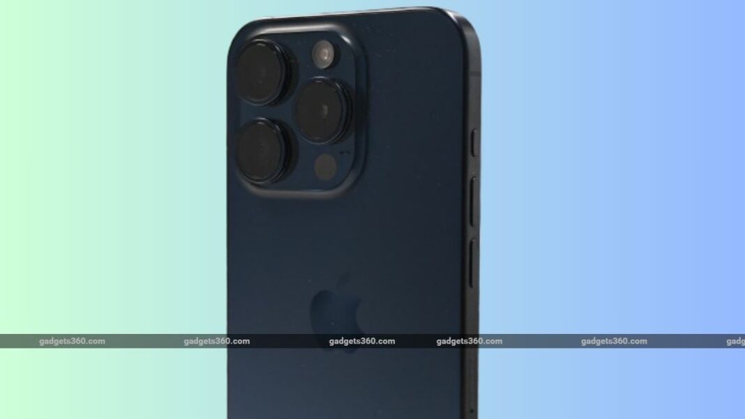 Smartphone with triple camera system on blue background.