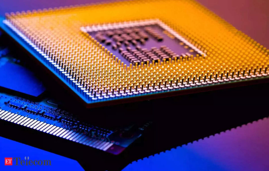 Close-up of microprocessor pins with blue and pink lighting.