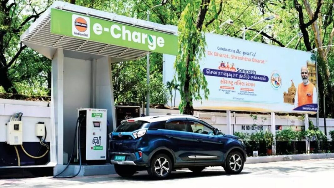 Electric vehicle charging station with advertising billboard.