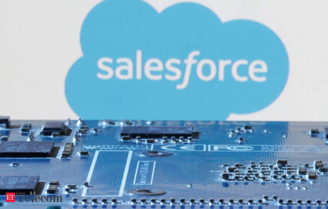 Salesforce logo over blurred circuit board.