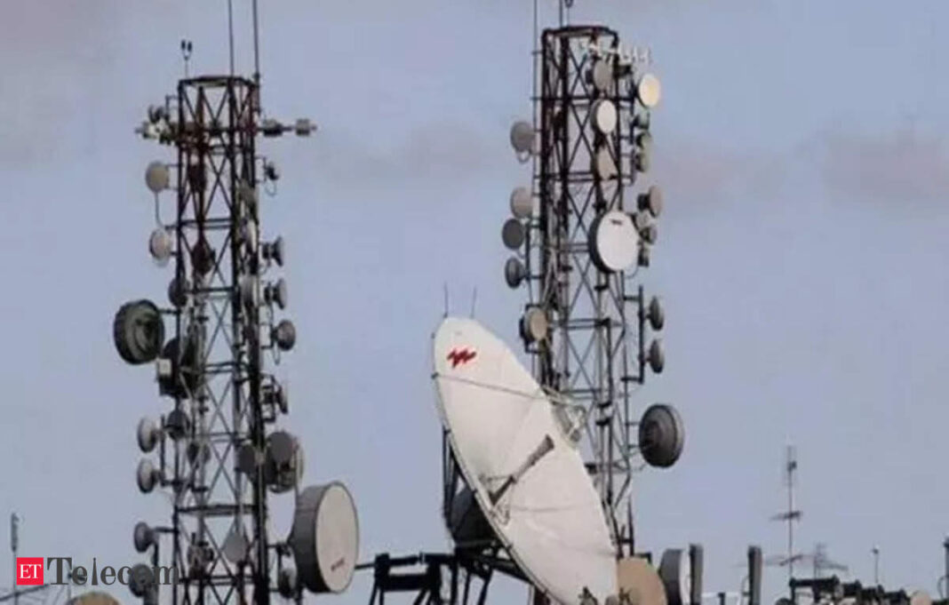 Telecommunication towers with antennas and satellite dish.