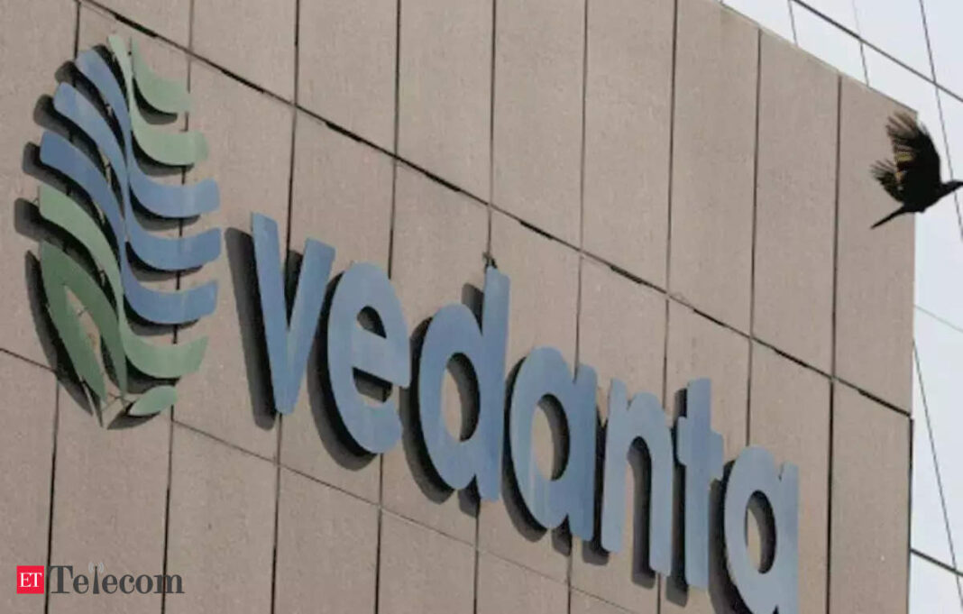 Vedanta corporate building signage with a bird flying by.