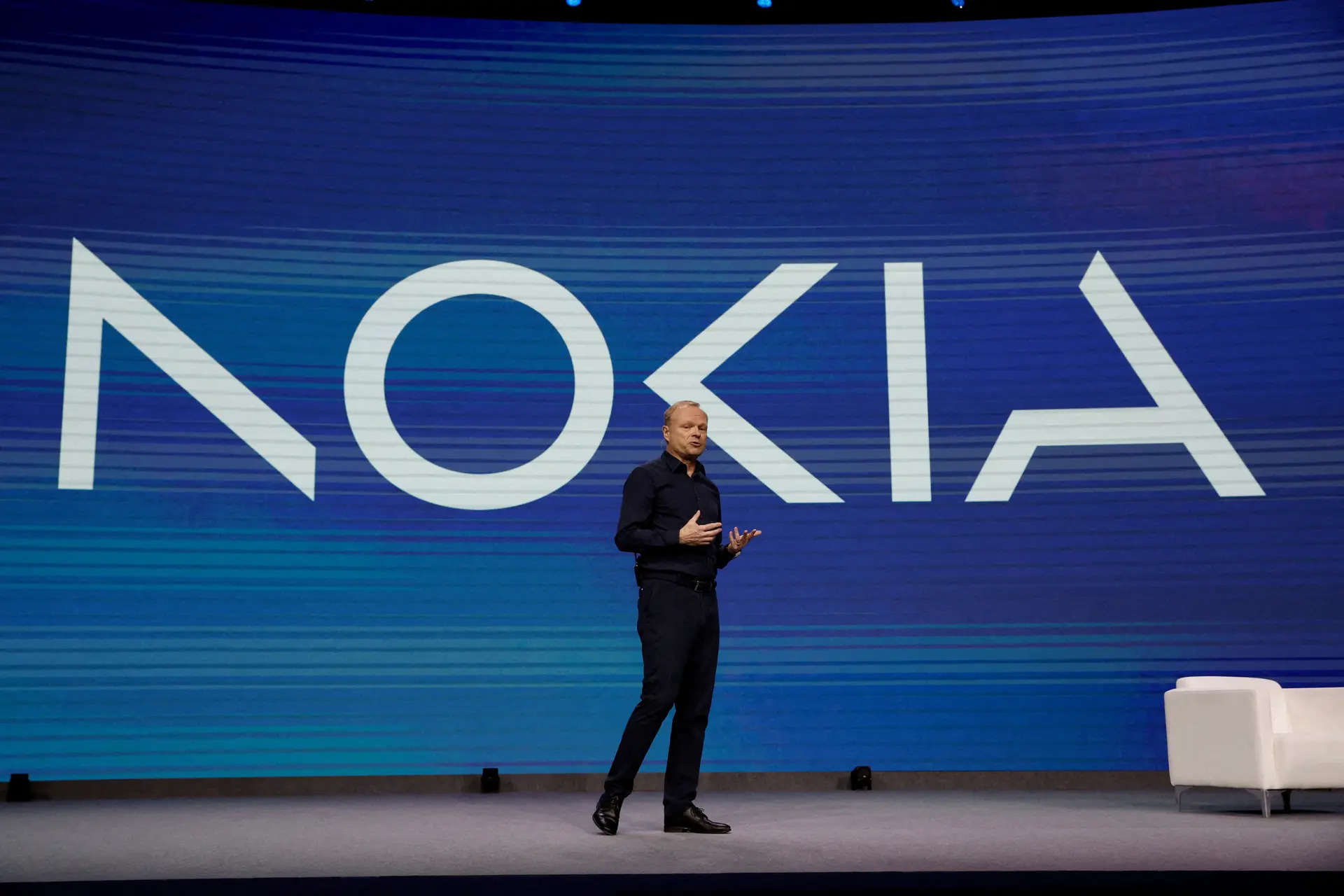 FILE PHOTO: CEO of Nokia Pekka Lundmark stands by a new company's logo displayed on a screen during a news conference at the GSMA's 2023 Mobile World Congress (MWC) in Barcelona, Spain February 28, 2023. REUTERS/Albert Gea/File Photo