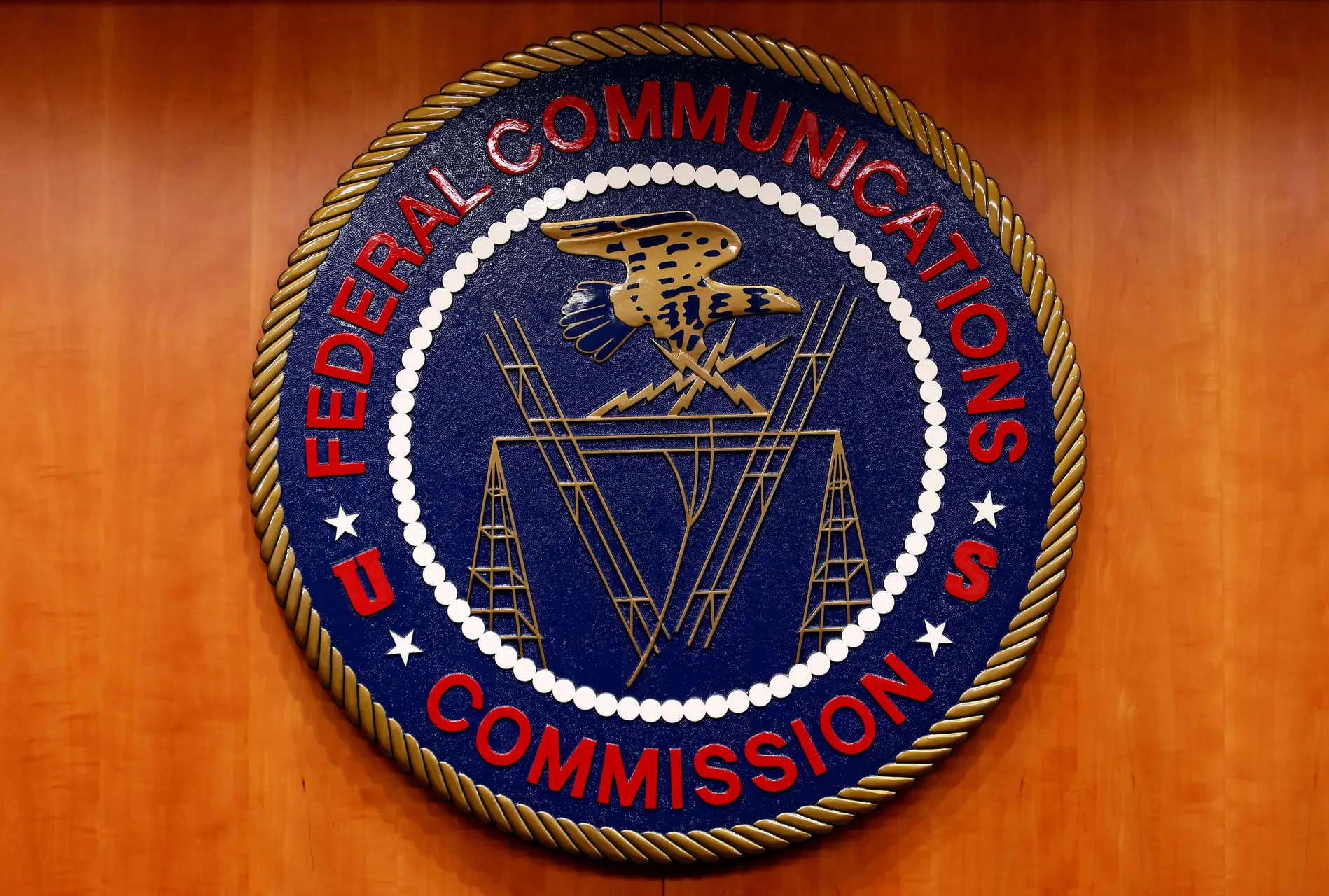 File Photo: The Federal Communications Commission logo is seen before the FCC Net Neutrality hearing in Washington February 26, 2015. REUTERS/Yuri Gripas/File Photo