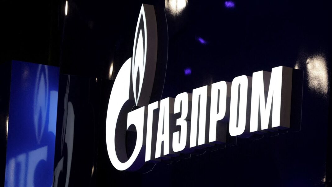 Illuminated Gazprom logo at night